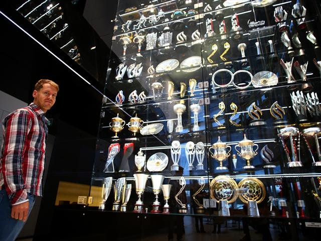 Sebastian Vettel with Red Bull trophies