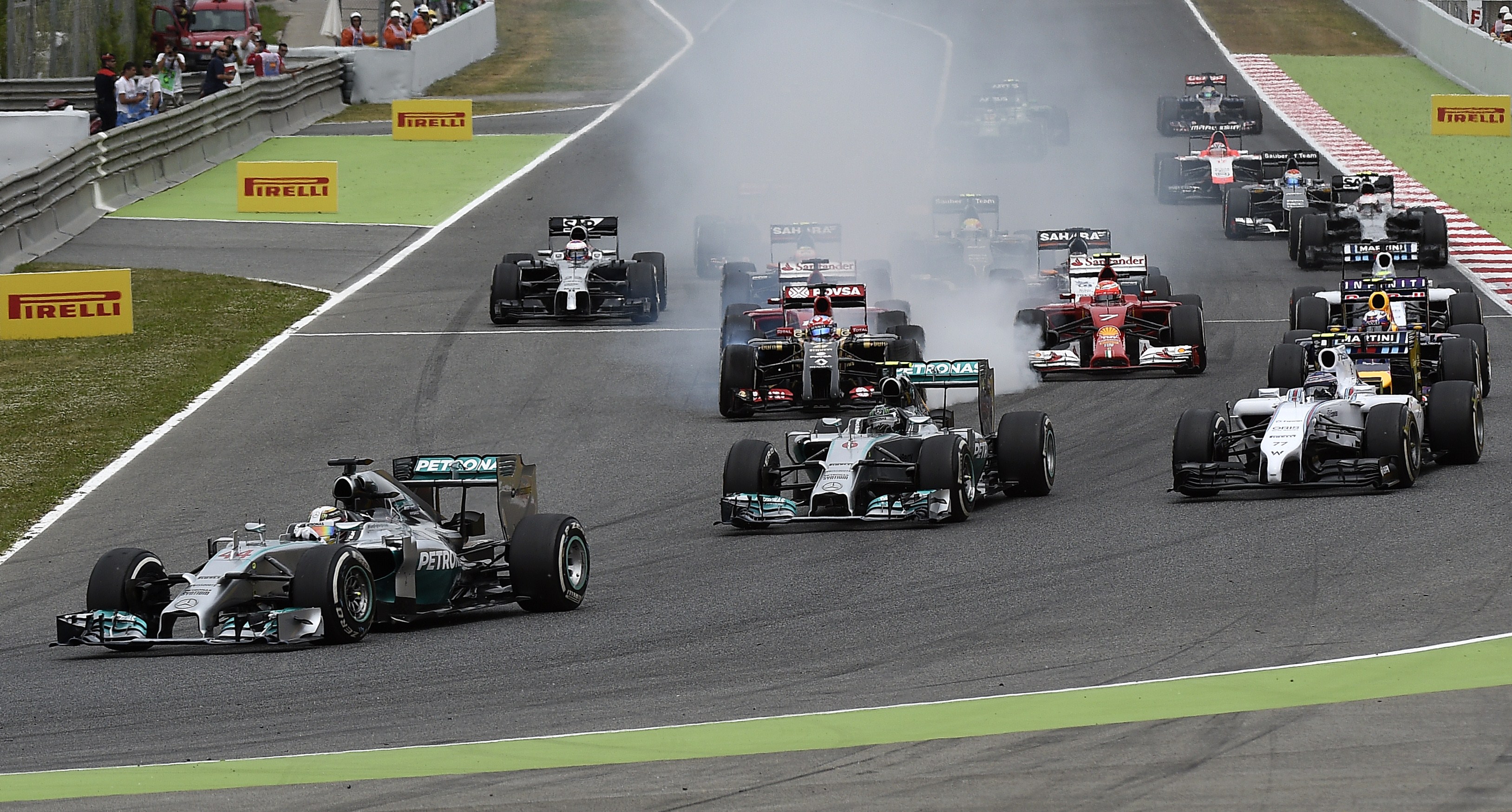 Mercedes-AMG's British driver Lewis Hamilton (front) leads after the start of the Spanish Formula One Grand Prix at the Circuit de Catalunya in Montmelo, on the outskirts of Barcelona on May 11, 2014. AFP PHOTO/ LLUIS GENE (Photo credit should read LLUIS GENE/AFP/Getty Images)